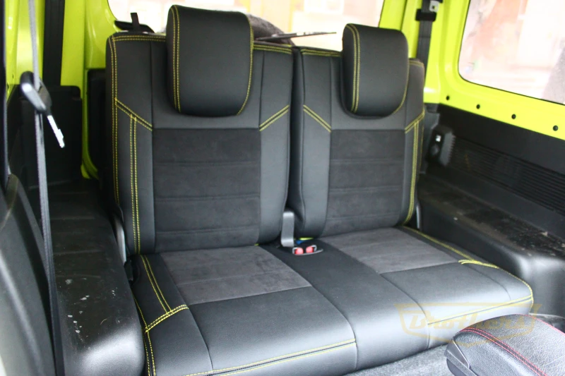 Чехлы на Suzuki Jimny 4 (3 двери) серии "Alcantara" - желтая строчка, продление передних сидений алькантарой