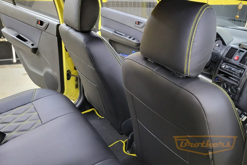 Авточехлы на Hyundai Getz, серии "Premium" (задний диван цельный) - желтая строчка, ромбы
